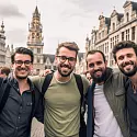 group of men celebrating a awesome guys trip in Brussels