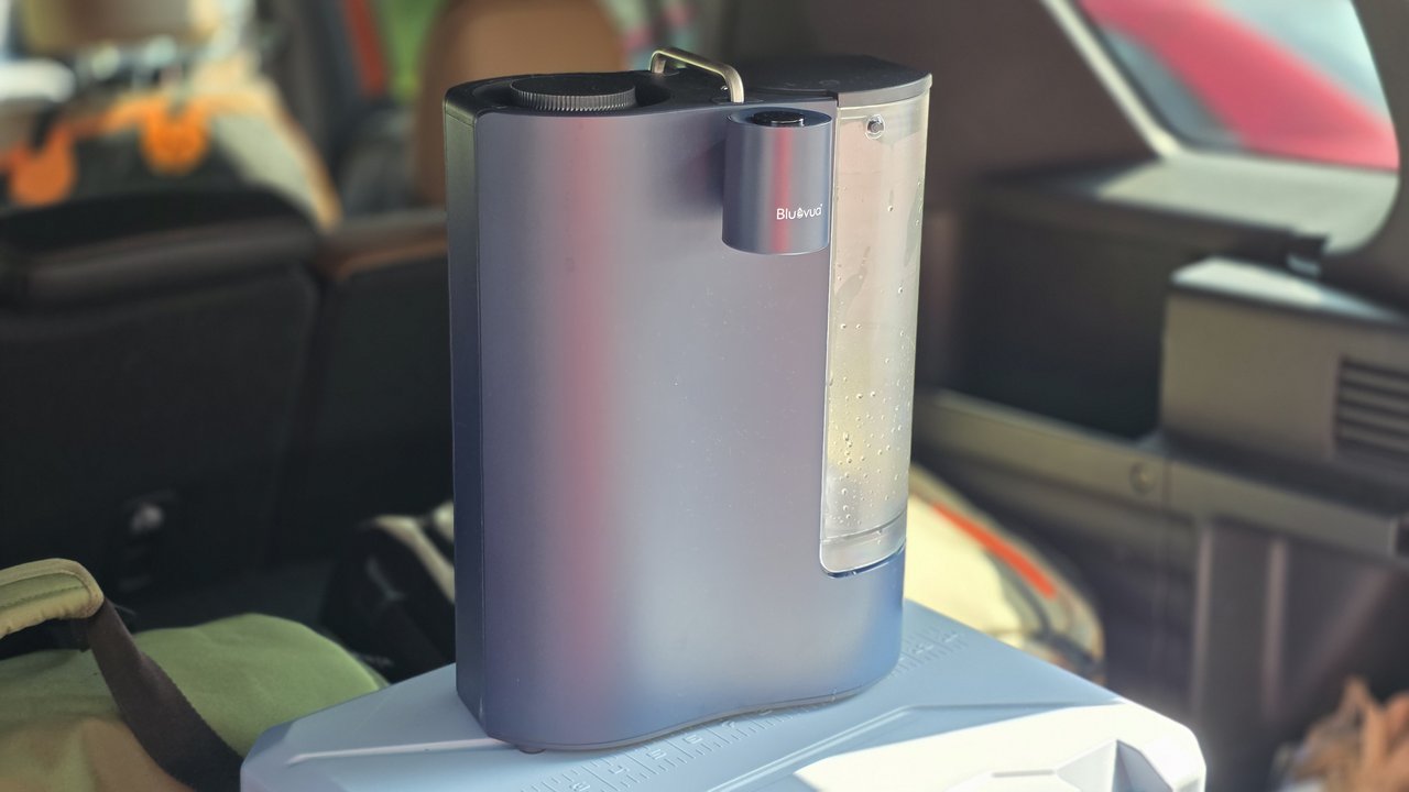Bluevua ROPOT-Travel portable reverse osmosis system packed in the cargo area of a Honda Passport