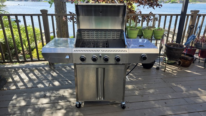 Electactic G41 Pro four-burner gas grill assembled and viewed straight-on with the lake visible in the background