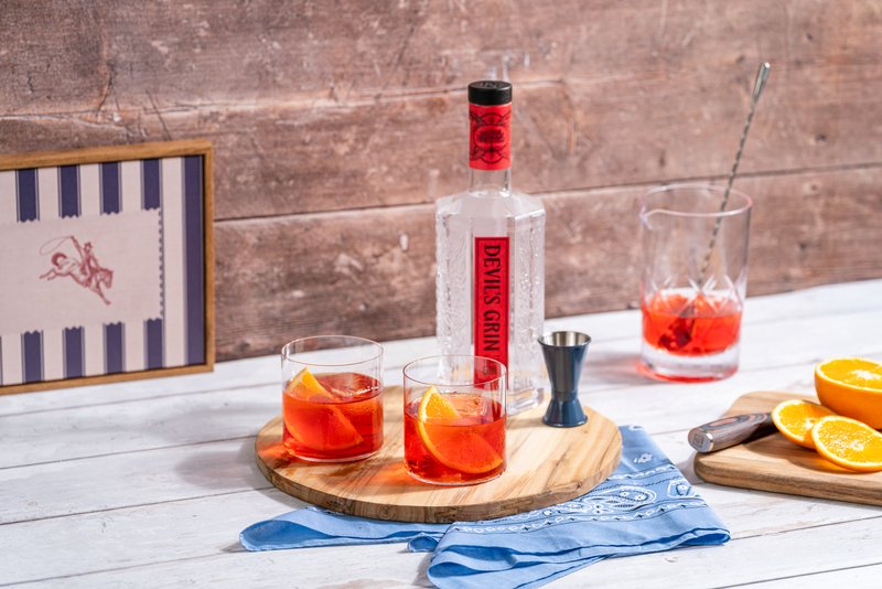 Devil's Grin Texas Gin Negronis with orange slices