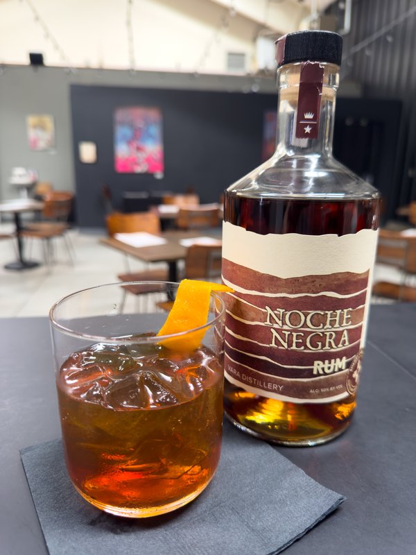 Desert Night Old Fashioned with a bottle of Vara Noche Negra rum
