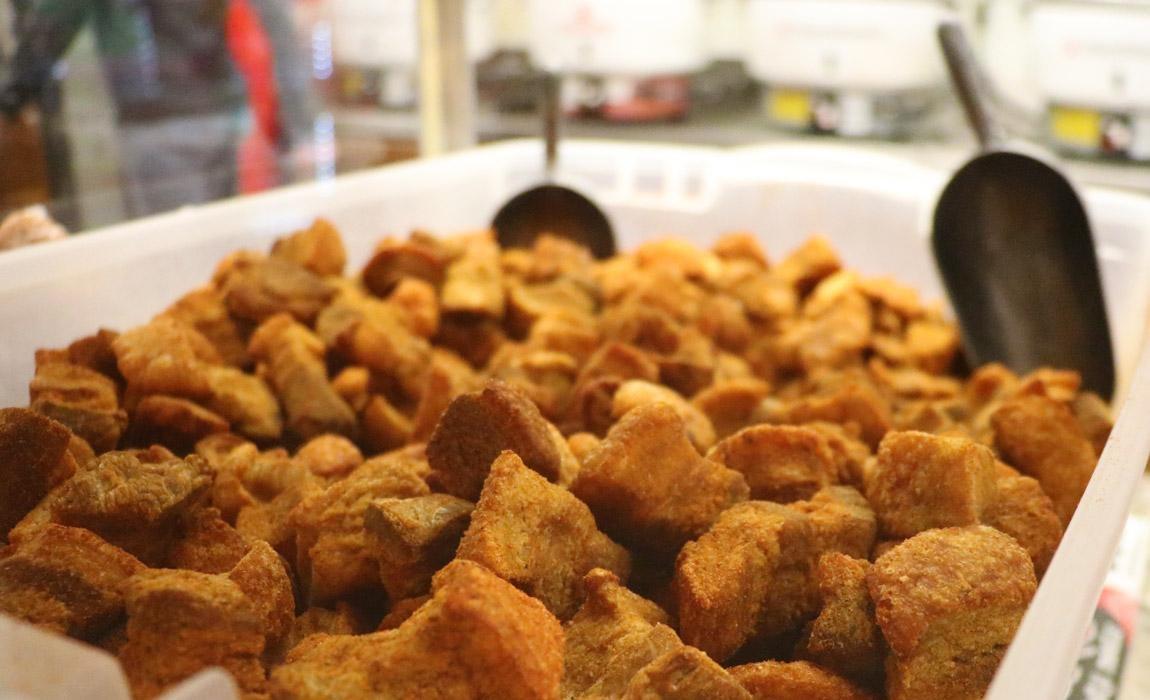 Cracklins are just one of the man-friendly foods you'll need to try when visiting Lafayette, Louisiana on a guys weekend.