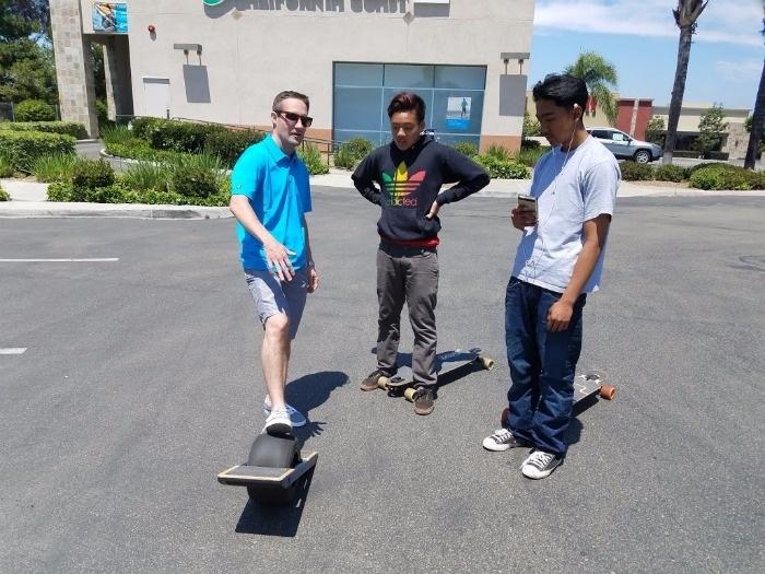 skaters checking out onewheel