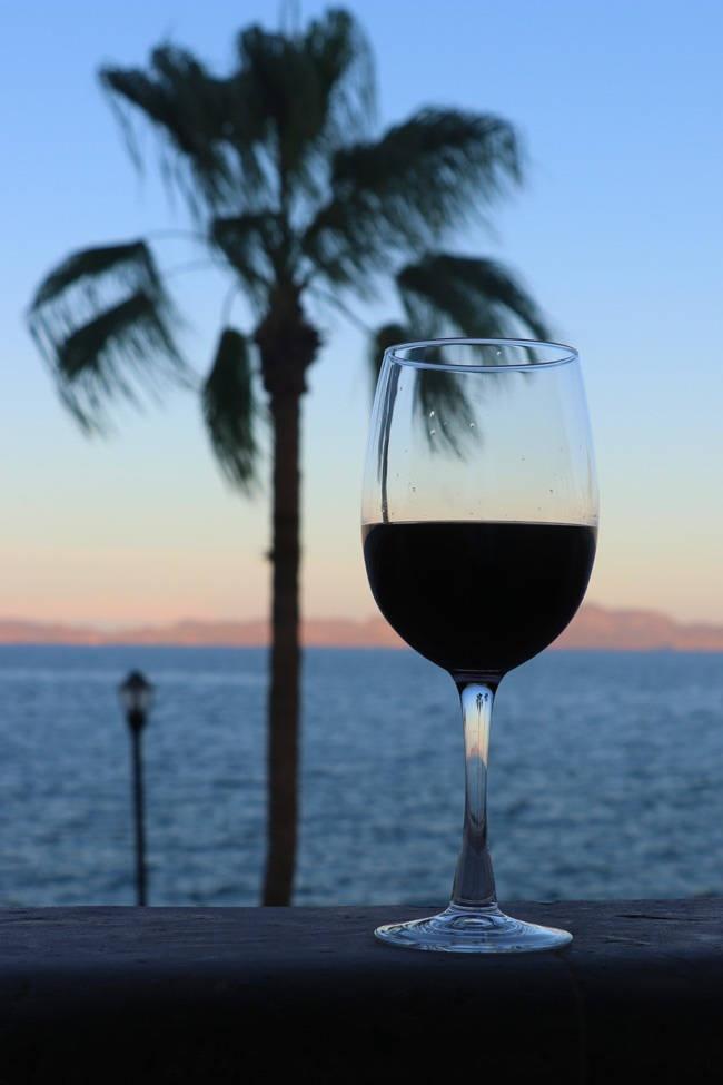 wine glass at sunset at la mision hotel loreto mexico