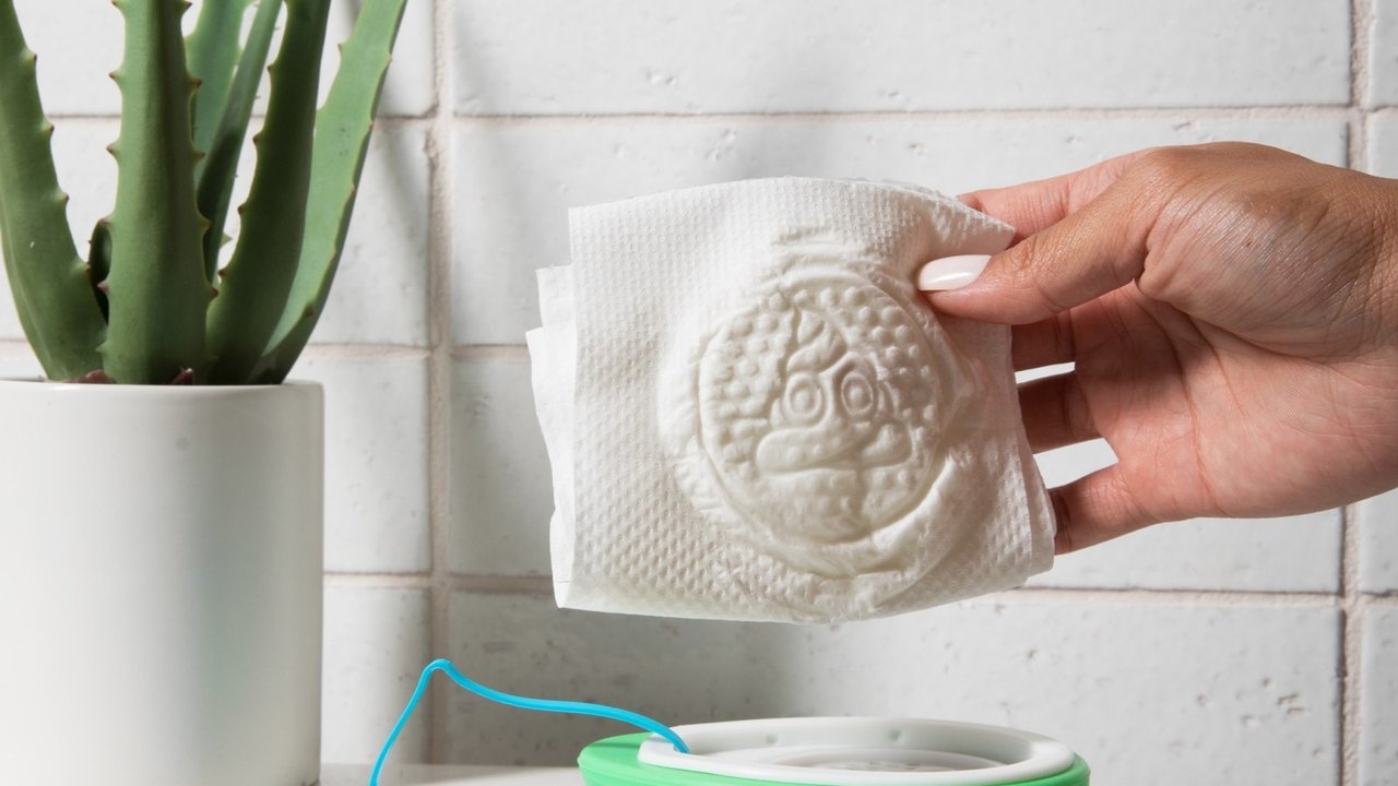 The UnWipe portable toilet paper enhancement device for travel