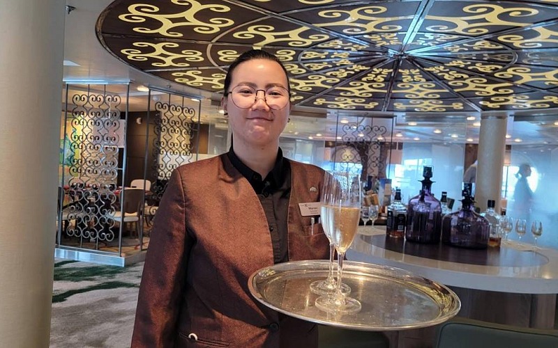 champagne host welcoming you to Celebrity Cruise